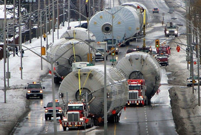 A red Mack company trailer